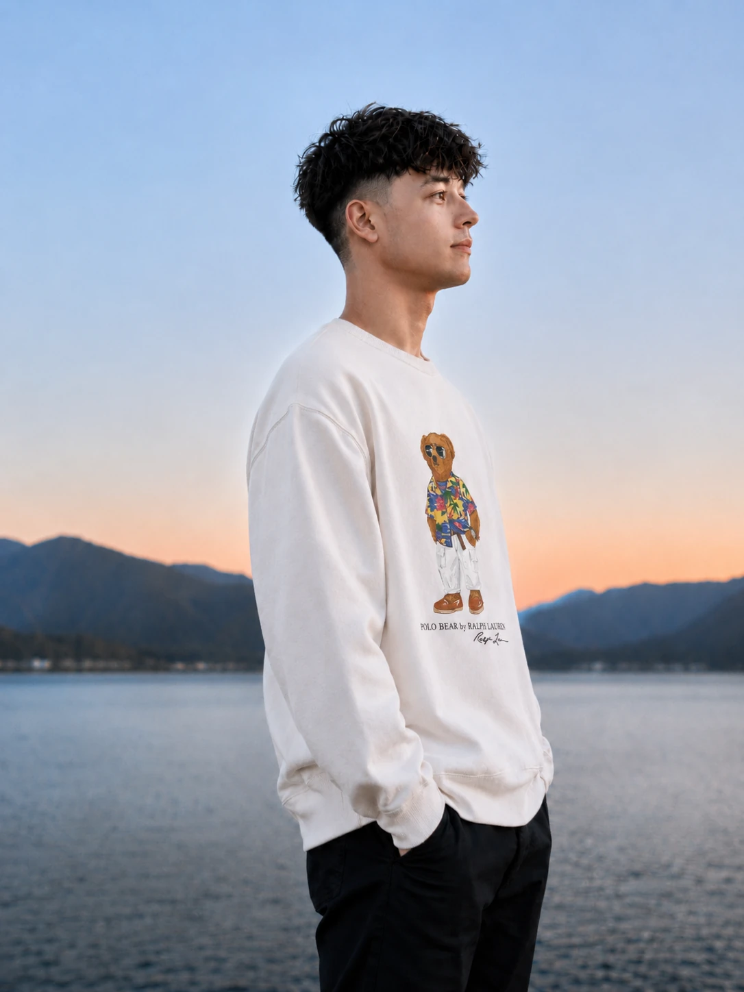 Portrait of Ethan by a mountain lake at dusk